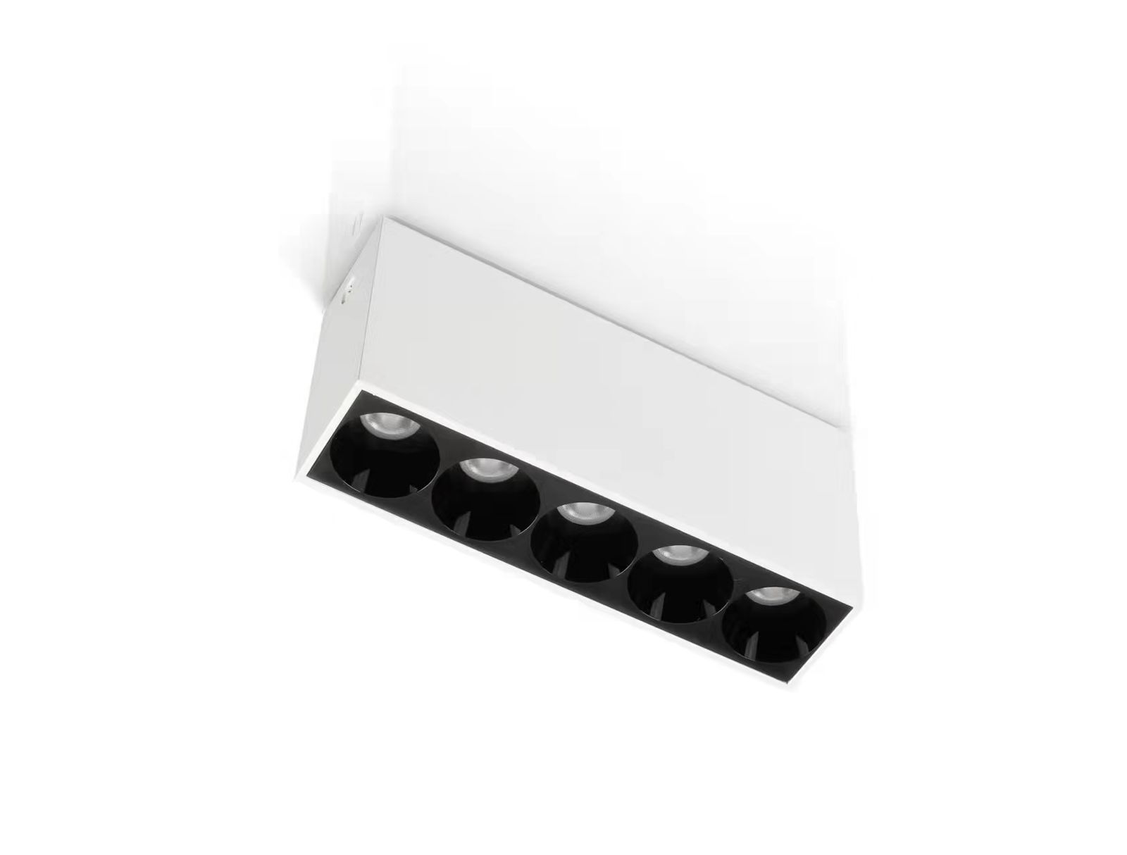 “Sleek cylindrical COB surface‑mounted LED light in matte finish installed on a ceiling”